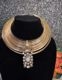 This type of set often uses a combination of different stone cuts, specifically the rectangular baguette and teardrop-shaped pear cuts, to achieve its intricate, high-shine design. It is a form of fashion or costume jewelry designed to mimic the appearance of fine gold and diamond pieces at a more affordable price point.