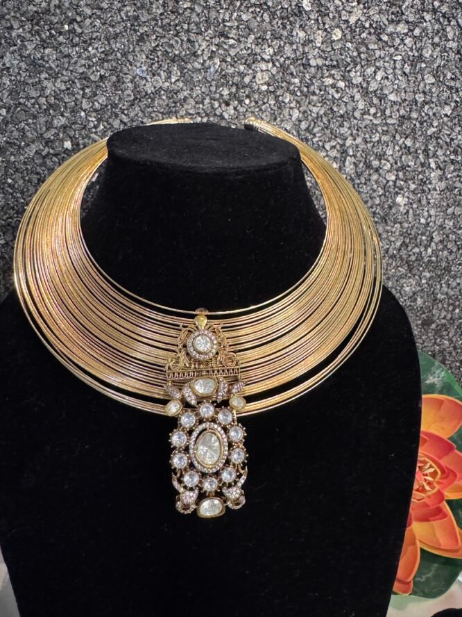 This type of set often uses a combination of different stone cuts, specifically the rectangular baguette and teardrop-shaped pear cuts, to achieve its intricate, high-shine design. It is a form of fashion or costume jewelry designed to mimic the appearance of fine gold and diamond pieces at a more affordable price point.