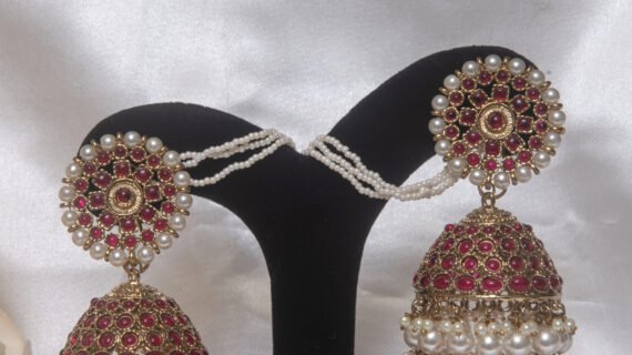 Gold Toned Ruby Jhumka Earrings with Pearl Tassels